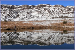 Nick Fishing Under A Snowy Backdrop